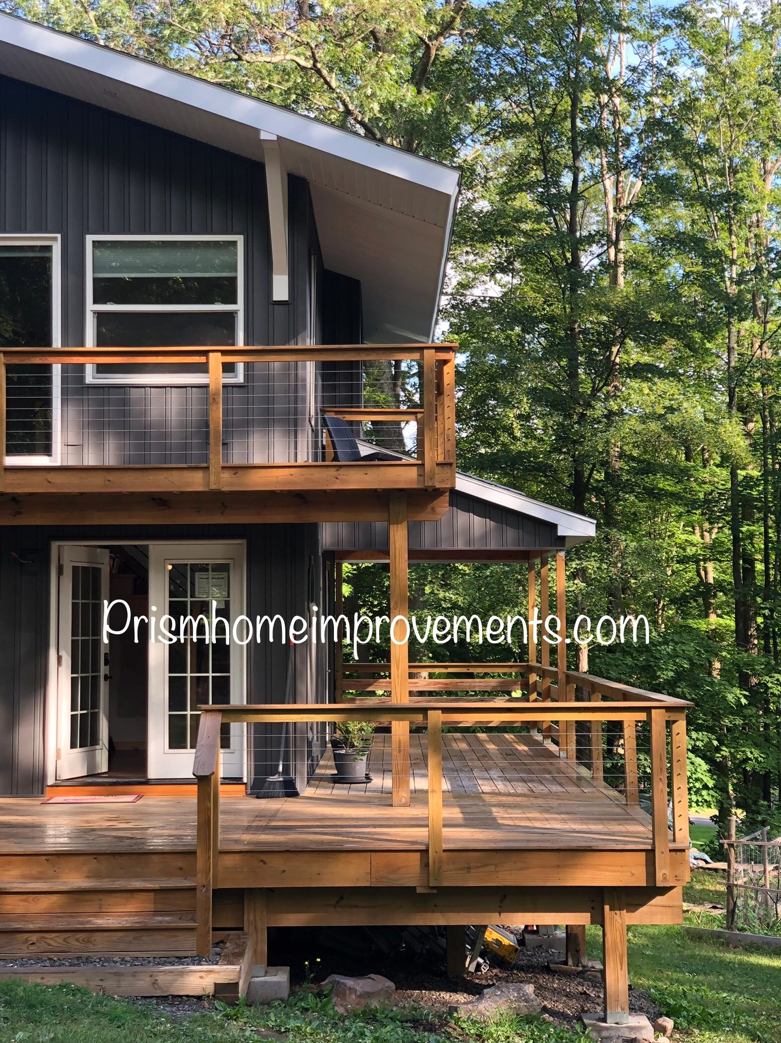Modern home exterior with deck at evening