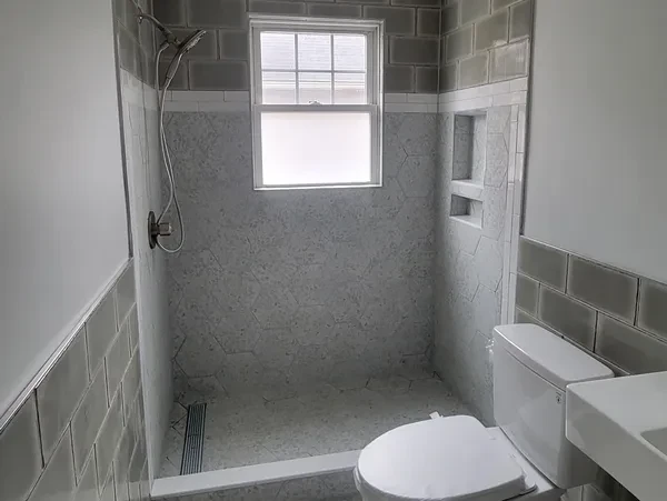 Gray hex tile shower renovation