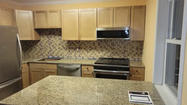 Kitchen with maple cabinets and granite countertop