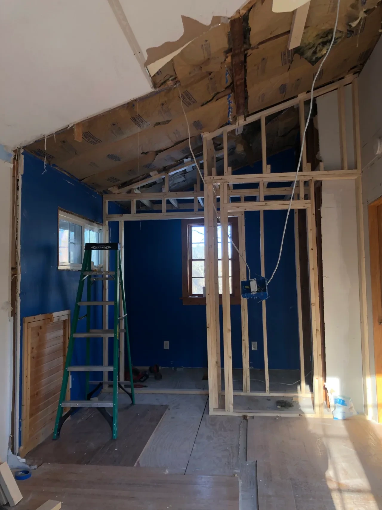 Interior walls opened during renovation — framing and demo phase
